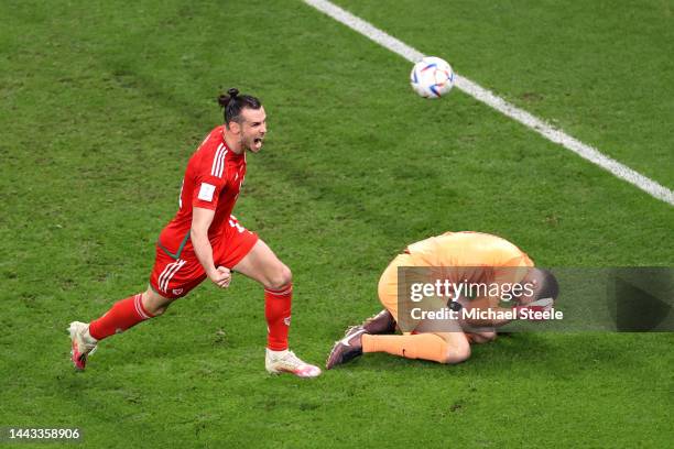 Gareth Bale of Wales celebrates after scoring their team's first goal via a penalty past Matt Turner of United States during the FIFA World Cup Qatar...