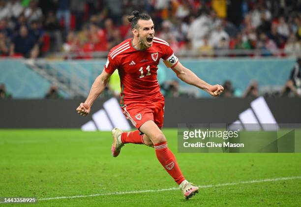 Gareth Bale of Wales celebrates after scoring their team's first goal via a penalty during the FIFA World Cup Qatar 2022 Group B match between USA...