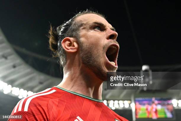 Gareth Bale of Wales celebrates after scoring their team's first goal via a penalty past Matt Turner of United States during the FIFA World Cup Qatar...