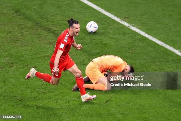 Gareth Bale of Wales celebrates after scoring their team's first goal via a penalty past Matt Turner of United States during the FIFA World Cup Qatar...