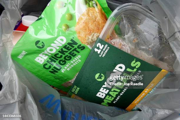 In this photo illustration, a Beyond Meat meatball as well as a chicken nuggets product in a grocery bag on November 21, 2022 in Miami, Florida....