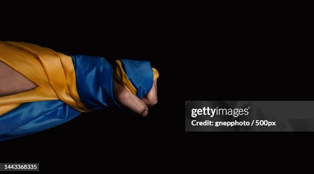 russian flag and ukraine flag in hands showing symbol of struggle war,bangkok,thailand - 外交 個照片及圖片檔