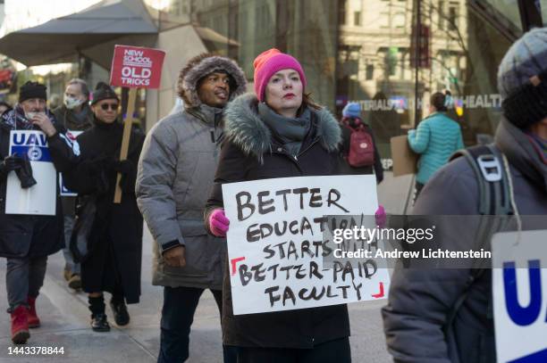 Part-time faculty members, accompanied by students, walk a picket line during a strike at the New School after union contract negotiations failed to...