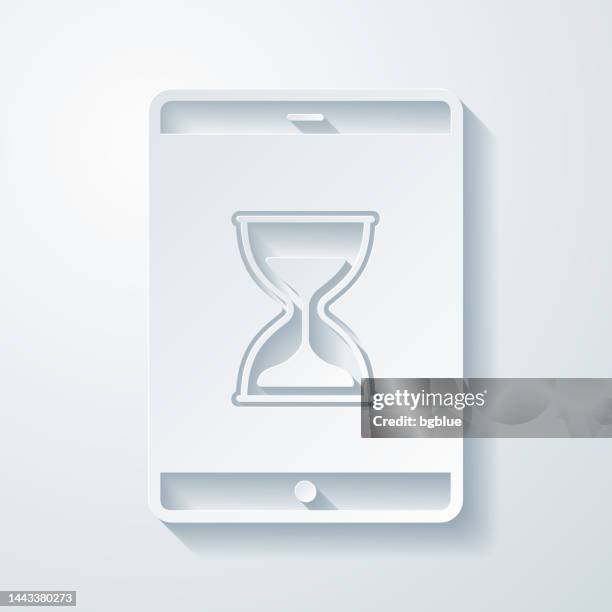 tablet pc with hourglass. icon with paper cut effect on blank background - application deadline stock illustrations