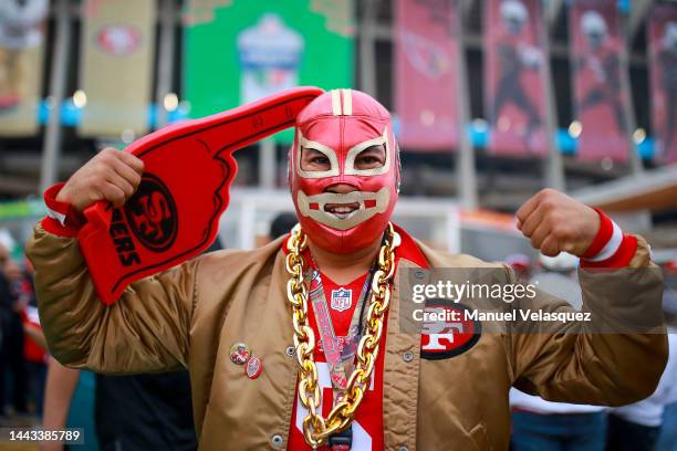 Fan poses for a photo prior to a game between the San Francisco 49ers and Arizona Cardinals at Estadio Azteca on November 21, 2022 in Mexico City,...