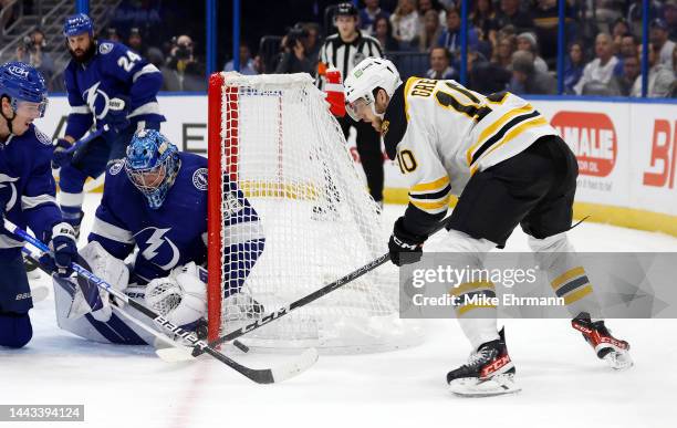 Andrei Vasilevskiy of the Tampa Bay Lightning stops a shot from A.J. Greer of the Boston Bruins during a game at Amalie Arena on November 21, 2022 in...