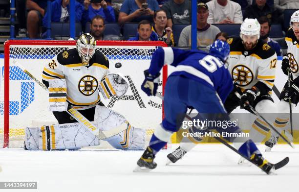 Linus Ullmark of the Boston Bruins stops a shot from Philippe Myers of the Tampa Bay Lightning during a game at Amalie Arena on November 21, 2022 in...
