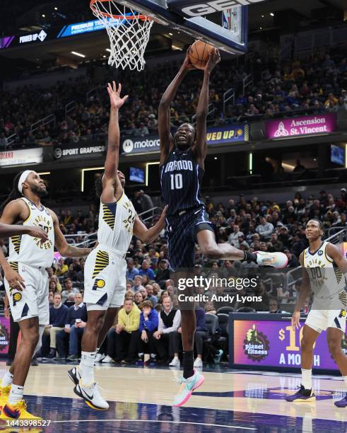 Bol Bol of the Orlando Magic shoots the ball against the Indiana Pacers at Gainbridge Fieldhouse on November 21, 2022 in Indianapolis, Indiana. NOTE...