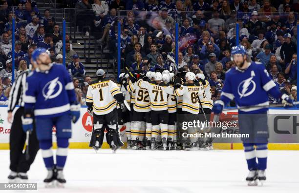 Patrice Bergeron of the Boston Bruins celebrates his 1000th goal during a game against the Tampa Bay Lightning at Amalie Arena on November 21, 2022...