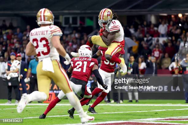 Brandon Aiyuk of the San Francisco 49ers catches a touchdown pass against the Arizona Cardinals during the second quarter at Estadio Azteca on...