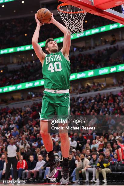 Luke Kornet of the Boston Celtics dunks against the Chicago Bulls during the first half at United Center on November 21, 2022 in Chicago, Illinois....