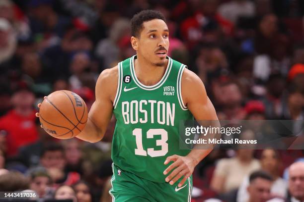 Malcolm Brogdon of the Boston Celtics dribbles up the court against the Chicago Bulls during the first half at United Center on November 21, 2022 in...