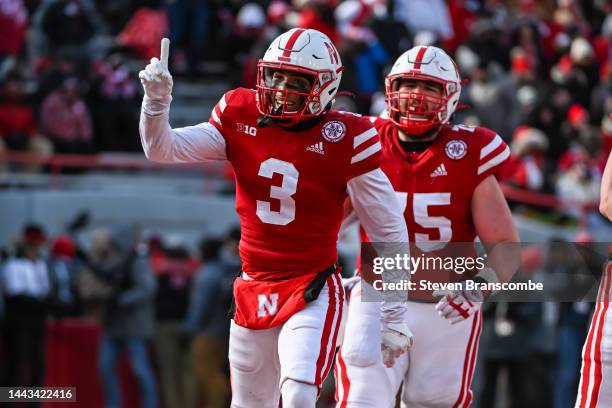 Wide receiver Trey Palmer of the Nebraska Cornhuskers celebrates a score with offensive lineman Trent Hixson against the Wisconsin Badgers during the...