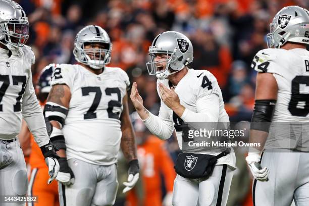 Derek Carr of the Las Vegas Raiders reacts during an NFL game between the Las Vegas Raiders and Denver Broncos at Empower Field At Mile High on...
