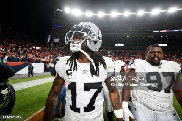 Davante Adams of the Las Vegas Raiders celebrates after scoring a touchdown to win in overtime during an NFL game between the Las Vegas Raiders and...