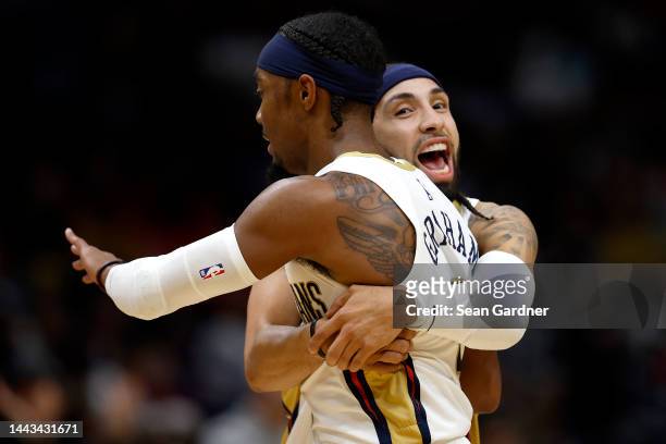 Jose Alvarado of the New Orleans Pelicans and Devonte' Graham of the New Orleans Pelicans react after scoring during the fourth quarter of an NBA...
