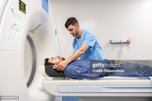 patient getting an mri scan at the hospital - cat scan 個照片及圖片檔