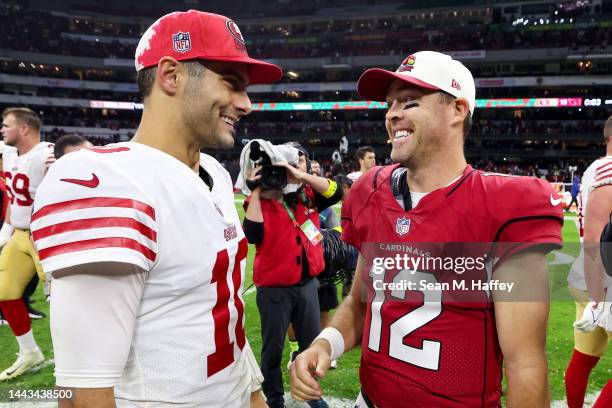 Jimmy Garoppolo of the San Francisco 49ers and Colt McCoy of the Arizona Cardinals meet on the field after their game at Estadio Azteca on November...