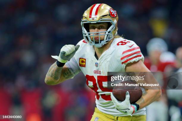 George Kittle of the San Francisco 49ers catches a pass for a touchdown against the Arizona Cardinals during the fourth quarter at Estadio Azteca on...