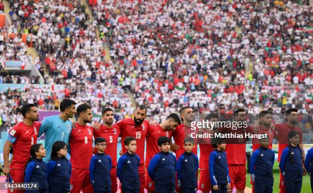 Iranian players line up for the national anthem prior to the FIFA World Cup Qatar 2022 Group B match between England and IR Iran at Khalifa...