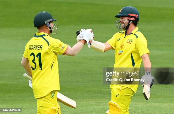 Travis Head of Australia ris congratulated by David Warner after reaching his century during game three of the One Day International series between...