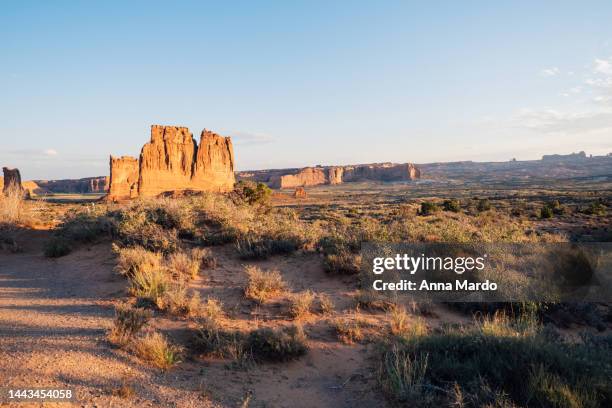 wide landscape in arches national park at sunrise - fiery furnace arches national park stock pictures, royalty-free photos & images