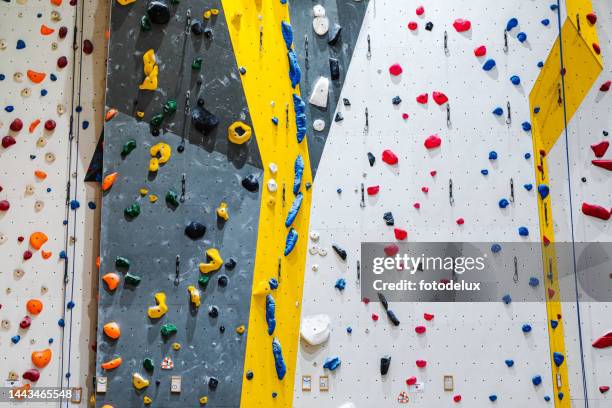 artificial rock climbing walls - clambering imagens e fotografias de stock