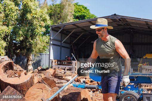 Australian man chopping firewood