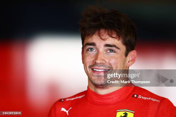 Charles Leclerc of Monaco and Ferrari looks on in the garage during Formula 1 testing at Yas Marina Circuit on November 22, 2022 in Abu Dhabi, United...