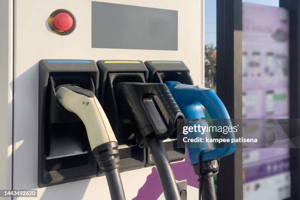 electric vehicle charging station - gas station friends stock pictures, royalty-free photos & images