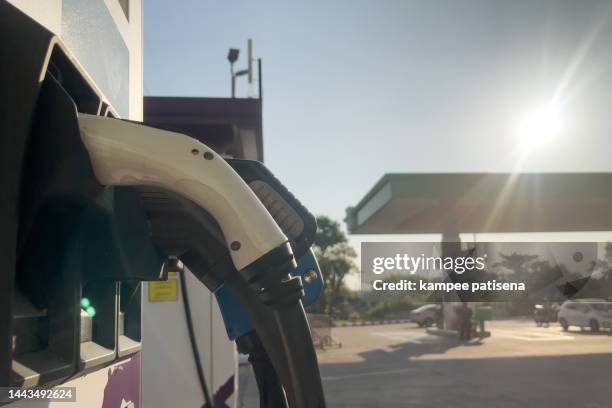 electric vehicle charging station - gas station friends stock pictures, royalty-free photos & images