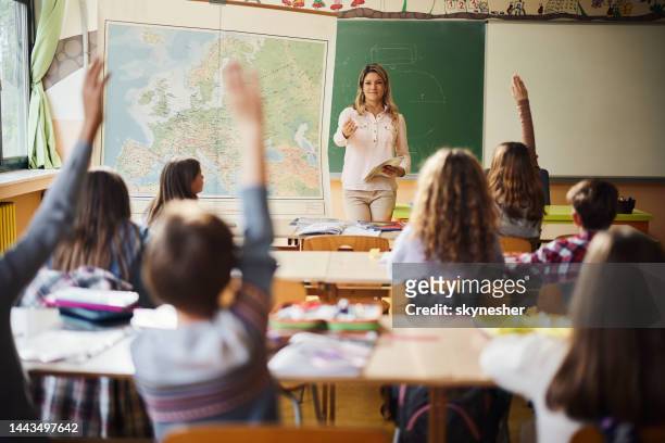 who is going to answer my question? - elementary school classroom stock pictures, royalty-free photos & images