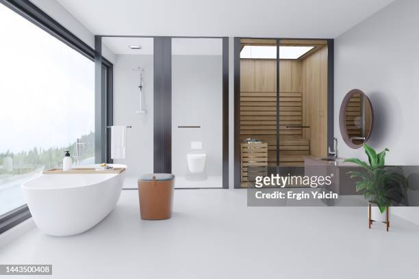 luxuriöses design-badezimmer mit blick auf die natur und sauna. - sauna stock-fotos und bilder