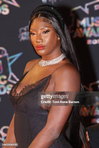 Aya Nakamura attends the 24th NRJ Music Awards - Red Carpet arrivals at Palais des Festivals on November 18, 2022 in Cannes, France.