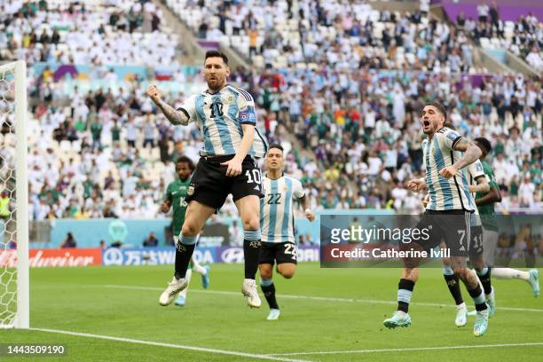 Lionel Messi of Argentina celebrates with teammates after scoring their team's first goal from the penalty spot during the FIFA World Cup Qatar 2022...