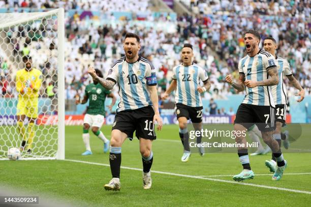 Lionel Messi of Argentina celebrates after scoring their team's first goal from the penalty spot during the FIFA World Cup Qatar 2022 Group C match...