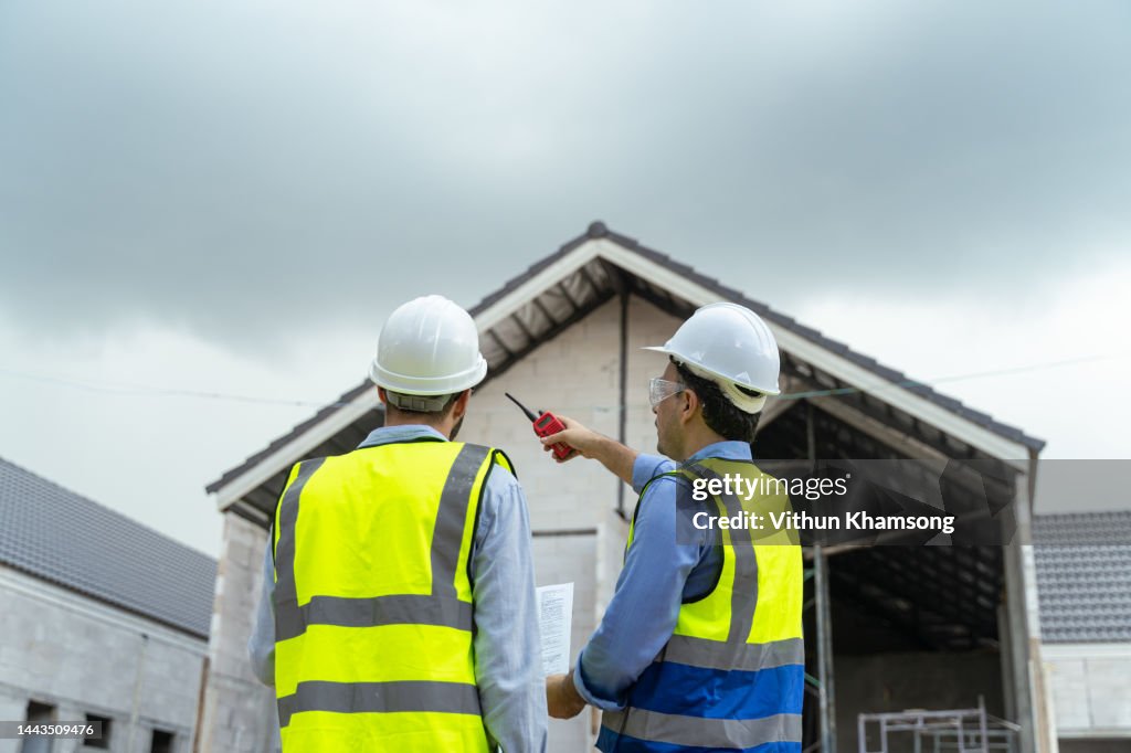 Team engineer check quality work at construction site.