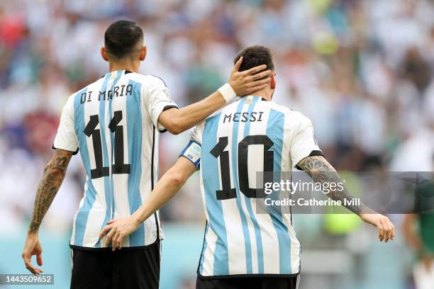 Lionel Messi of Argentina celebrates with Angel Di Maria after scoring their team's first goal from the penalty spot during the FIFA World Cup Qatar...