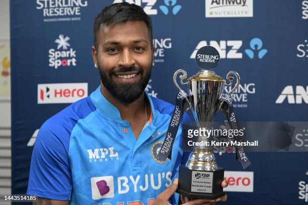 Hardik Pandya of India with the series trophy following game three of the T20 International series between New Zealand and India at McLean Park on...