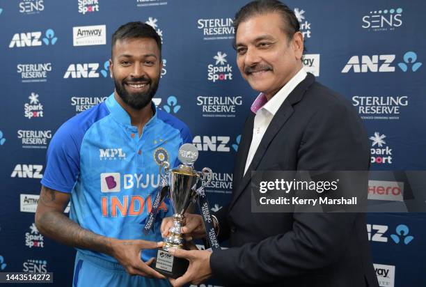 Hardik Pandya of India with the series trophy following game three of the T20 International series between New Zealand and India at McLean Park on...