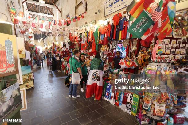 Fans shop at local shops at Souq Waqif in the Mushayrib district on November 22, 2022 in Doha, Qatar.