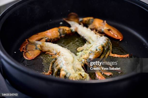 closeup of a lobster in a pan for paella - spanish food stock pictures, royalty-free photos & images