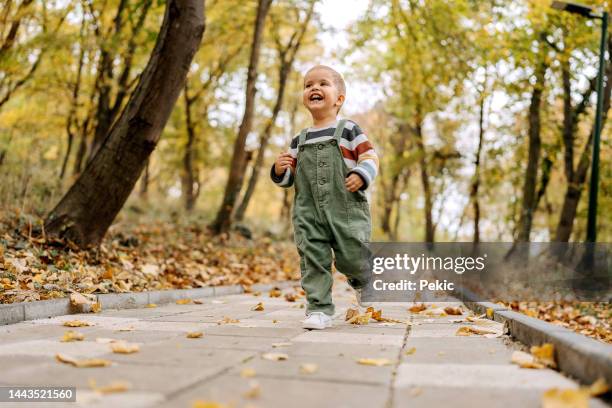 happiness is freedom - baby run stock pictures, royalty-free photos & images