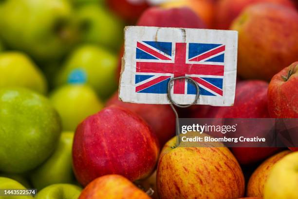 a british flag on a pile of apples - brexit stock pictures, royalty-free photos & images