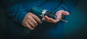 close-up  hand holding an electric drill