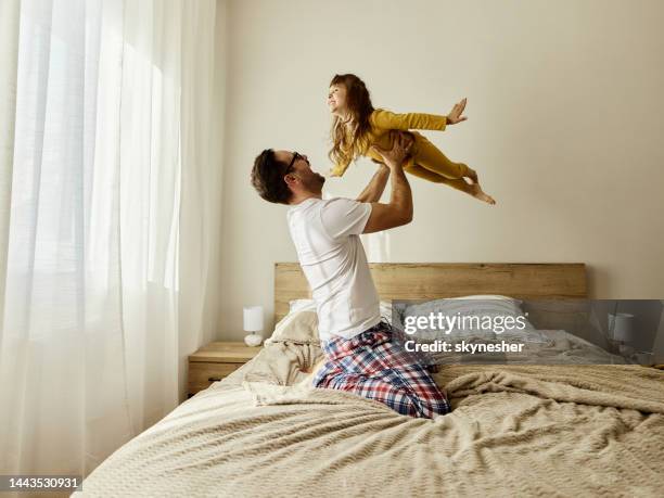 daddy, i'm flying like an airplane! - father playing stock pictures, royalty-free photos & images