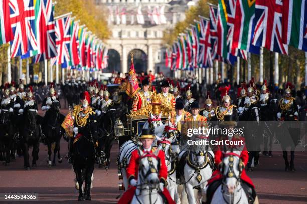 The State Carriage carrying Camilla, Queen Consort, King Charles III and South African President, Cyril Ramaphosa led by a mounted division of the...