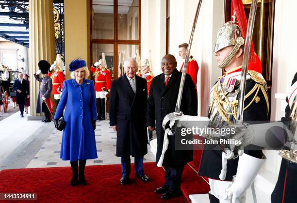 Camilla, Queen Consort, King Charles III and South African President, Cyril Ramaphosa arrive at the Grand Entrance of Buckingham Palace during a...