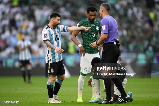 Lionel Messi of Argentina speaks with referee Slavko Vincic during the FIFA World Cup Qatar 2022 Group C match between Argentina and Saudi Arabia at...