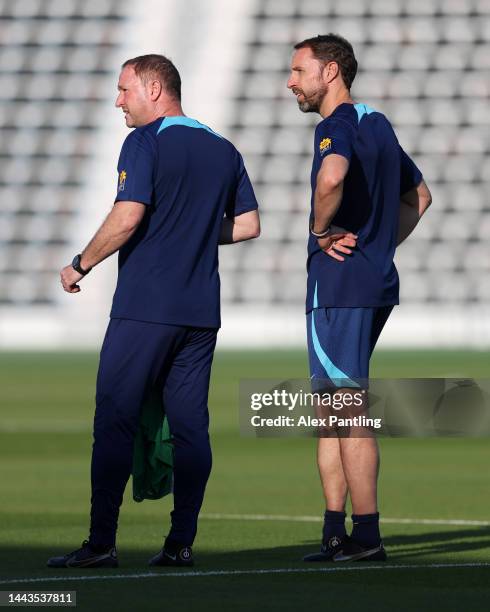 Gareth Southgate , Head Coach of England, looks on with Steve Holland, Assistant Coach of England during the England Training Session at Al Wakrah...